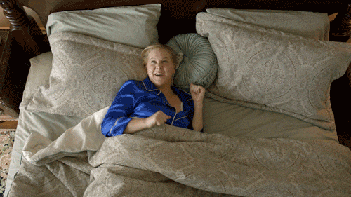 Woman waking up refreshed in the morning